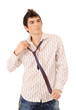 boy correcting a tie