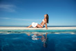 Woman relaxing in a swimming pool Woman relaxing in a swimming pool