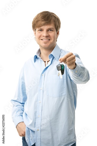 Photo: Young man holding ignition keys Young man holding ignition keys