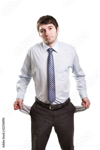 Photo: Sad and broke businessman with empty pockets Sad and broke businessman with empty pockets