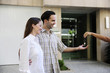 Owner of a new apartment: Couple receiving keys