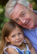 Grandfather cuddling his granddaughter