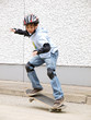 child skateboarding with helmet, knee pads & elbow protection