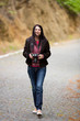 Young lady with photo camera