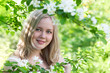 Young woman in spring blossom close-up Young woman in spring blossom close-up