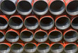 Casing pipe ready to be run in the hole on a drilling platform