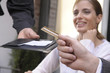 Hand of a man paying a bill in a restaurant