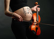 Pregnant woman with violin