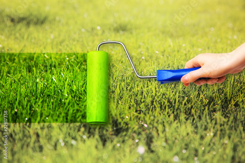 Photo: Young woman painting on grass Young woman painting on grass