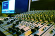 Sound mixer, closeup of the knobs with computer.