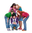 friends looking at cellphone and laughing friends looking at cellphone and laughing