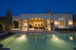 Lit swimming pool and building exterior