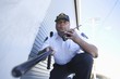 Armed security guard investigates with walk talky