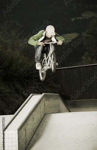 Photo: BMX rider in mid-air BMX rider in mid-air
