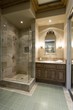 Marble shower cubicle with tiled green floor