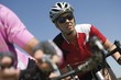 Foto: determined mid adult cyclist determined mid adult cyclist