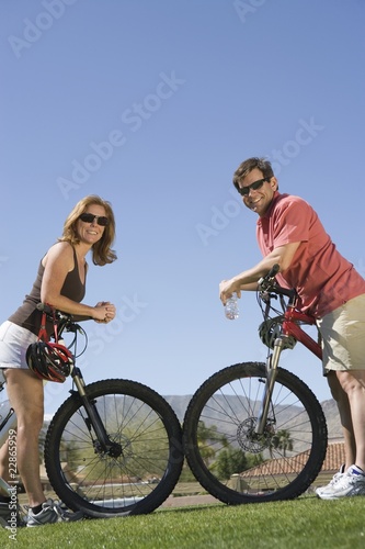 Photo: Mature couple on cycling holiday, face to face Mature couple on cycling holiday, face to face