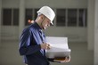 Young man holds documentation file