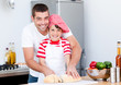 Portrait of a smiling father and his son preparing a meal