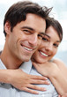 Portrait of a lovely young couple together with arms around