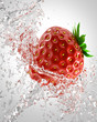 fresh strawberries in a spray of water