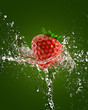 fresh strawberries in a spray of water