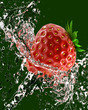 fresh strawberries in a spray of water