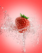 fresh strawberries in a spray of water