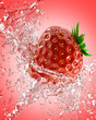 fresh strawberries in a spray of water