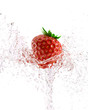 fresh strawberries in a spray of water