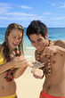 couple discover a small crab on lanikai beach