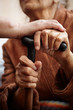 adult helping senior in hospital