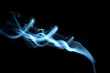 Blue smoke on black background