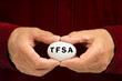 Man holds white egg with TFSA written on it Man holds white egg with TFSA written on it