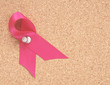 pink ribbon on a corkboard pink ribbon on a corkboard
