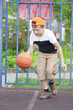 Boy dribbling basketball
