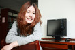 Asian girl sitting in front of the computer Asian girl sitting in front of the computer