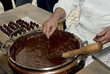 Close-up on dark chocolate delicacies maker Close-up on dark chocolate delicacies maker