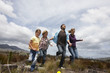 Family running in the meadow