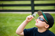 A youthful boy blowing bubbles on a summer day