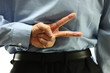 Business man finger sign