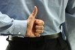 Business man finger sign