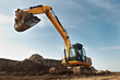 Excavator loader in construction sandpit area