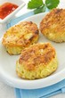 Three potato cakes on a white plate Three potato cakes on a white plate