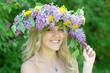 happy woman in plural flower garland