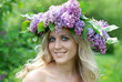 pretty woman in lilac flowers pretty woman in lilac flowers