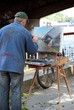 Street Artist paints bridge painting