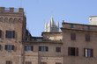 Cathedral Tower behind Old City Buildings. Siena, Italy