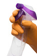 hand with rubber glove holding a bottle of cleanser