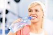 Sportswoman drinks water Sportswoman drinks water